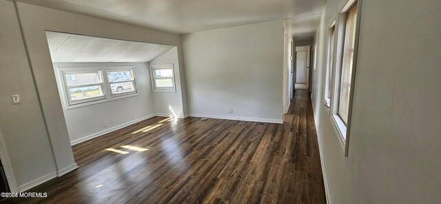 1 Panda Ln, Whiting, NJ 08759 - empty room with lofted ceiling, dark wood finished floors, and baseboards