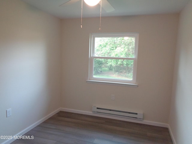 5D Wintergreen Ln, Whiting, NJ 08759 - empty room with a baseboard heating unit, ceiling fan, wood finished floors, and baseboards