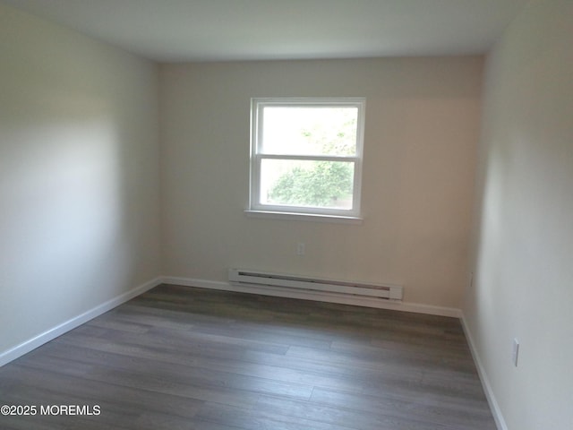 5D Wintergreen Ln, Whiting, NJ 08759 - empty room featuring a baseboard radiator, wood finished floors, and baseboards