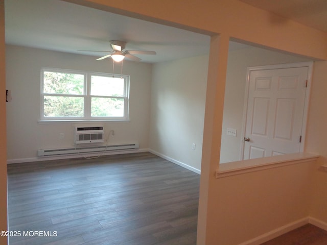 5D Wintergreen Ln, Whiting, NJ 08759 - spare room with a baseboard radiator, ceiling fan, wood finished floors, a wall mounted AC, and baseboards