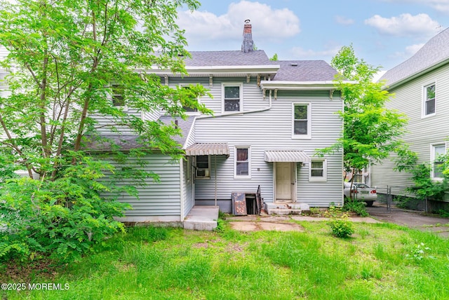 137 Seabreeze Way, Keansburg, NJ 07734 - rear view of property with a chimney and roof with shingles