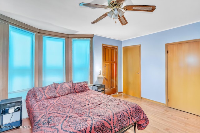 137 Seabreeze Way, Keansburg, NJ 07734 - bedroom with wood finished floors, ceiling fan, and ornamental molding