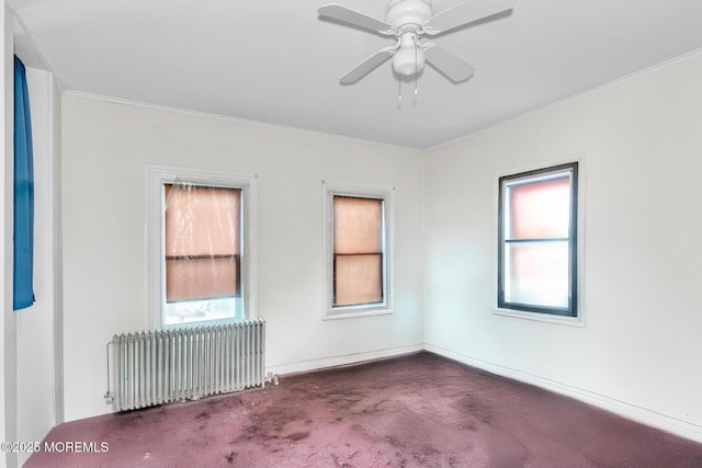 137 Seabreeze Way, Keansburg, NJ 07734 - empty room with radiator heating unit, carpet floors, crown molding, a ceiling fan, and baseboards