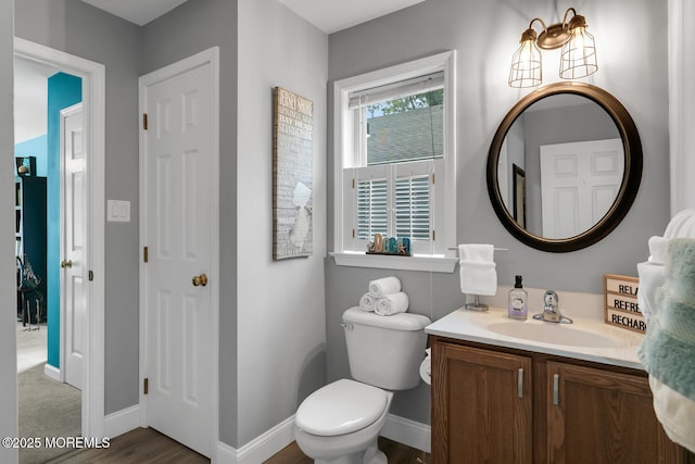 324 Boland Ave, Brick, NJ 08724 - bathroom with vanity, toilet, baseboards, and wood finished floors
