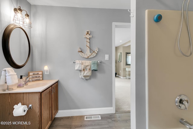 324 Boland Ave, Brick, NJ 08724 - bathroom with vanity, baseboards, wood finished floors, and tub / shower combination