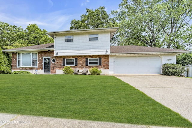 36 Wilson Dr, Howell, NJ 07731 - tri-level home with driveway, a garage, brick siding, a front yard, and roof with shingles