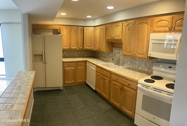 45 Ocean Ave Unit 8D, Monmouth Beach, NJ 07750 - kitchen with tile countertops, white appliances, a sink, dark tile patterned floors, and recessed lighting