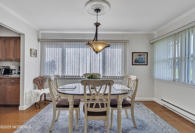 5 Lodge Ct, Brick, NJ 08724 - dining room featuring baseboard heating, ornamental molding, baseboards, and dark wood-style floors
