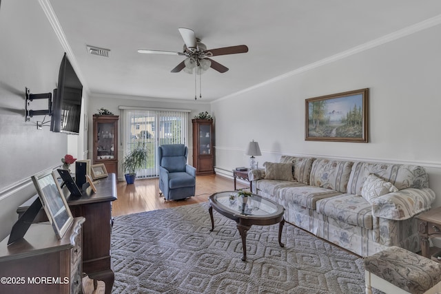 5 Lodge Ct, Brick, NJ 08724 - living area with a ceiling fan, crown molding, wood finished floors, and baseboard heating