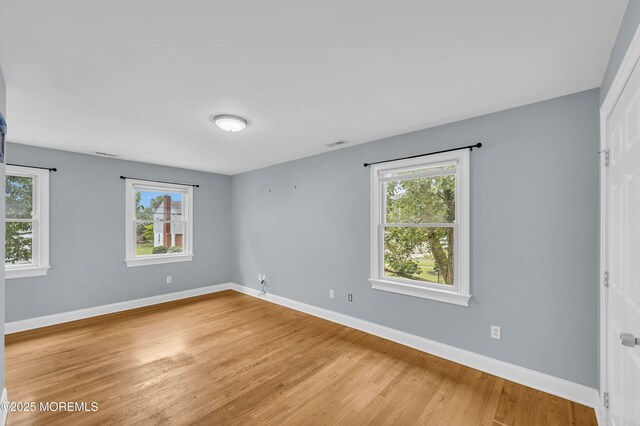 645 Campbell Ave, Long Branch, NJ 07740 - unfurnished room with plenty of natural light, light wood-style floors, and baseboards