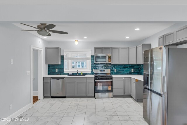 645 Campbell Ave, Long Branch, NJ 07740 - kitchen with appliances with stainless steel finishes, gray cabinetry, a sink, and recessed lighting