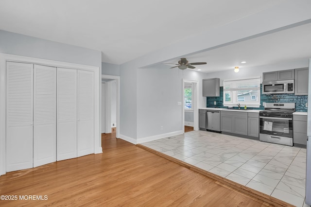 645 Campbell Ave, Long Branch, NJ 07740 - kitchen with appliances with stainless steel finishes, gray cabinets, light countertops, ceiling fan, and a sink