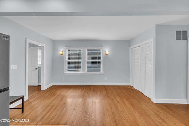 645 Campbell Ave, Long Branch, NJ 07740 - unfurnished living room with light wood-type flooring and baseboards