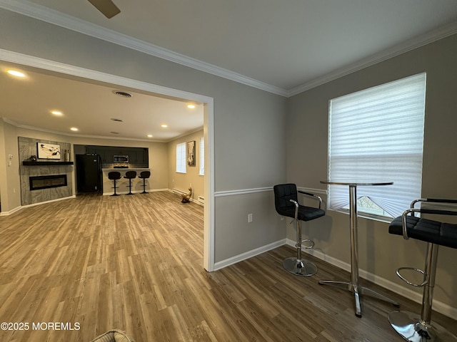 7B Drake St, Whiting, NJ 08759 - workout room featuring wood finished floors, baseboards, crown molding, recessed lighting, and a tile fireplace