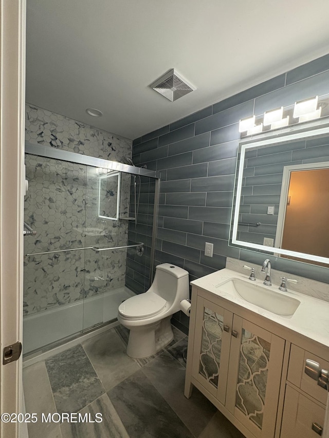 7B Drake St, Whiting, NJ 08759 - bathroom featuring toilet, vanity, a stall shower, and tile walls