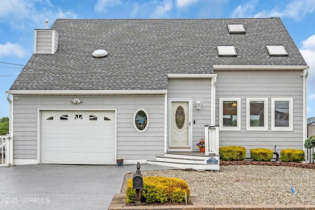 654 Fairview Ln, Forked River, NJ 08731 - view of front of property featuring a shingled roof, driveway, and a chimney