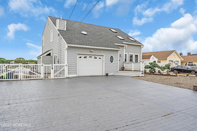 654 Fairview Ln, Forked River, NJ 08731 - traditional-style home with a gate, a garage, decorative driveway, and a shingled roof