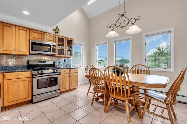 654 Fairview Ln, Forked River, NJ 08731 - kitchen with appliances with stainless steel finishes, high vaulted ceiling, backsplash, light tile patterned floors, and glass insert cabinets