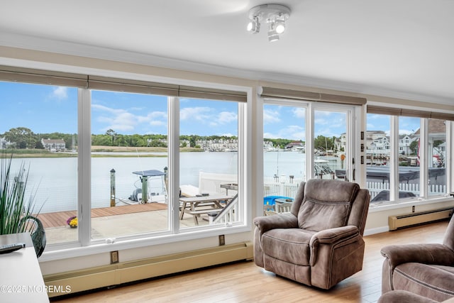 654 Fairview Ln, Forked River, NJ 08731 - sunroom featuring a baseboard heating unit, baseboard heating, a water view, and plenty of natural light