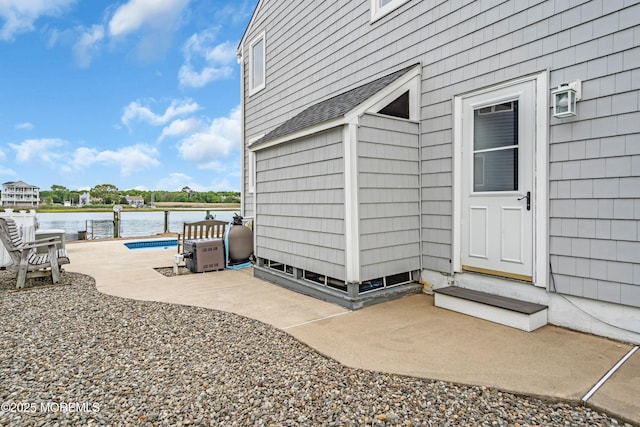 654 Fairview Ln, Forked River, NJ 08731 - entrance to property featuring a patio, a water view, roof with shingles, and an outdoor pool