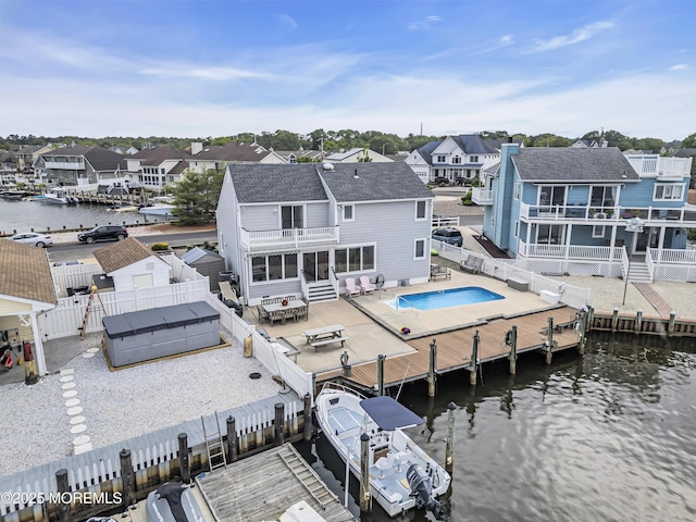 654 Fairview Ln, Forked River, NJ 08731 - rear view of property with a fenced backyard, a residential view, a patio, a water view, and a sunroom
