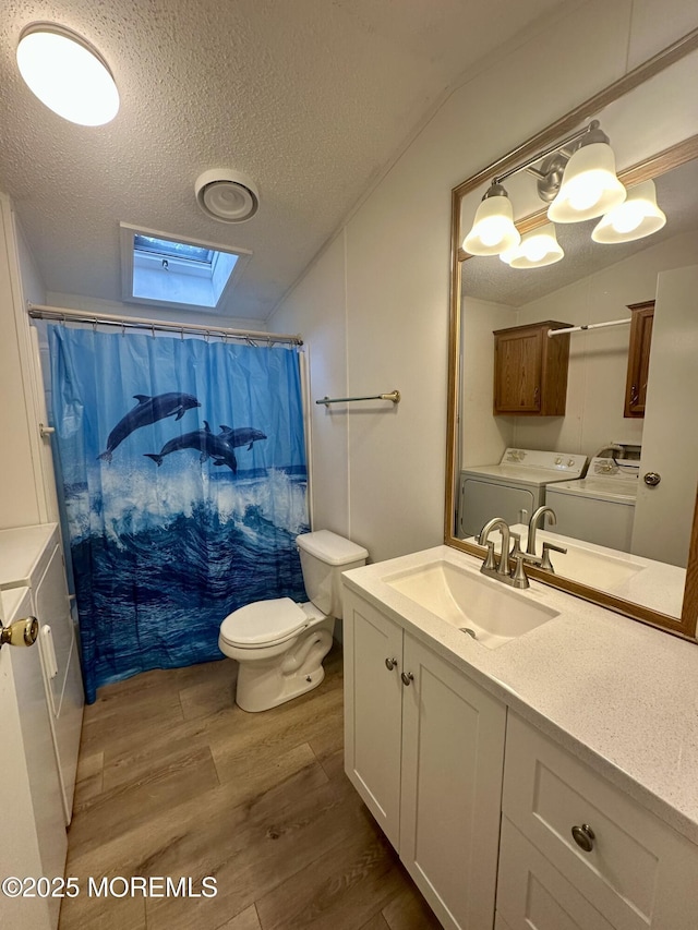11 B Trail Trail, Brick, NJ 08724 - full bathroom with washer and clothes dryer, lofted ceiling, a skylight, a textured ceiling, and wood finished floors