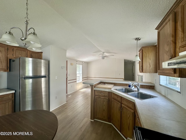 11 B Trail Trail, Brick, NJ 08724 - kitchen featuring freestanding refrigerator, a ceiling fan, brown cabinets, a textured ceiling, and lofted ceiling