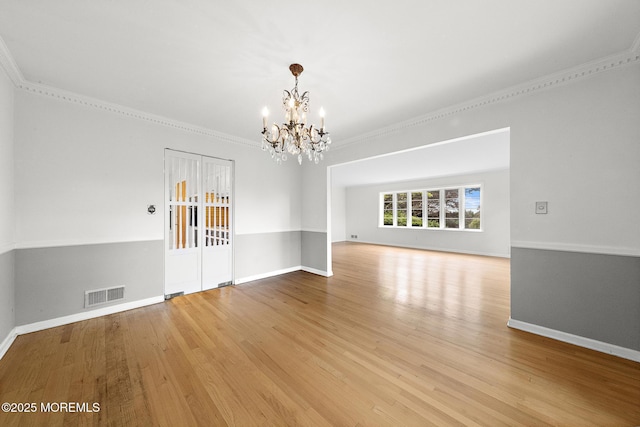 23 Fox Hill Dr, Little Silver, NJ 07739 - unfurnished room with a chandelier, light wood-type flooring, crown molding, and baseboards