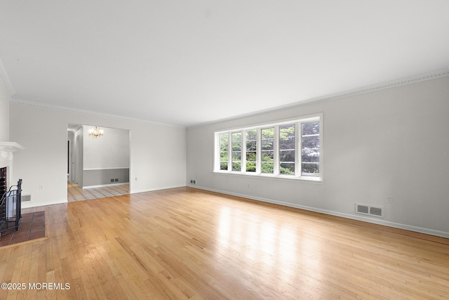23 Fox Hill Dr, Little Silver, NJ 07739 - unfurnished living room featuring crown molding, light wood finished floors, baseboards, a fireplace, and a chandelier