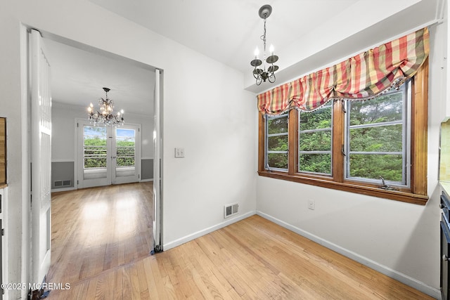 23 Fox Hill Dr, Little Silver, NJ 07739 - unfurnished dining area with a chandelier, light wood-style floors, and baseboards