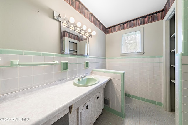 23 Fox Hill Dr, Little Silver, NJ 07739 - bathroom featuring vanity, tile walls, tile patterned flooring, and a wainscoted wall