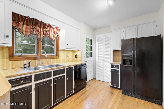 23 Fox Hill Dr, Little Silver, NJ 07739 - kitchen featuring black appliances, a sink, white cabinets, light wood finished floors, and tasteful backsplash