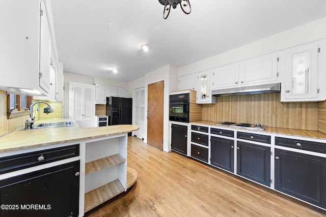 23 Fox Hill Dr, Little Silver, NJ 07739 - kitchen featuring under cabinet range hood, a sink, black appliances, white cabinets, and light countertops