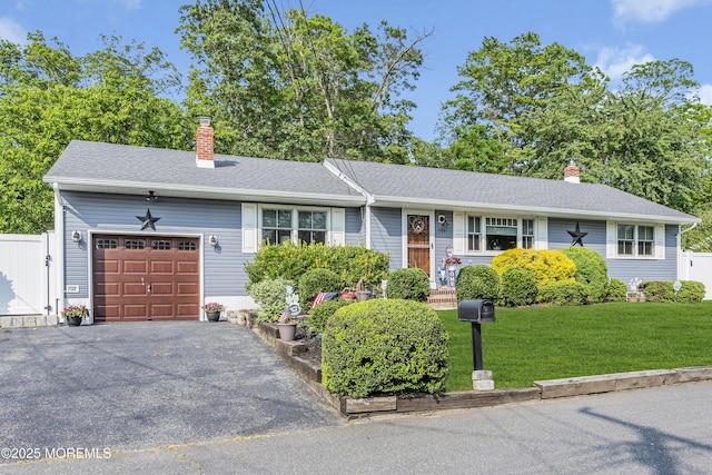 711 Hardean Rd, Brick, NJ 08724 - ranch-style home featuring an attached garage, a chimney, a front lawn, and asphalt driveway