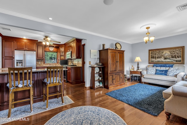 711 Hardean Rd, Brick, NJ 08724 - living room featuring a chandelier, dark wood-style flooring, ornamental molding, a ceiling fan, and recessed lighting