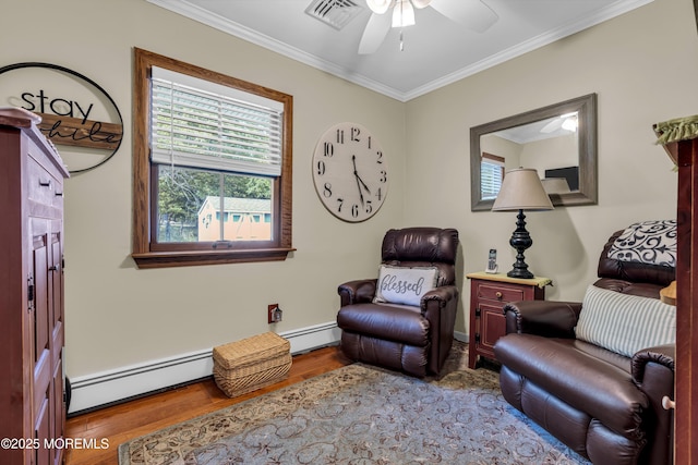 711 Hardean Rd, Brick, NJ 08724 - living area featuring a baseboard radiator, a ceiling fan, wood finished floors, plenty of natural light, and crown molding
