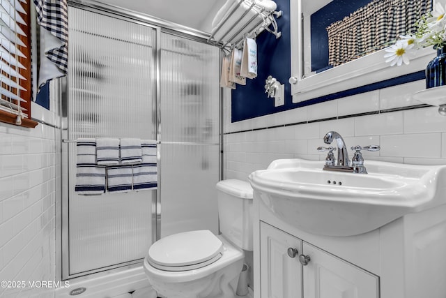 711 Hardean Rd, Brick, NJ 08724 - bathroom featuring tile walls, a shower stall, vanity, and toilet