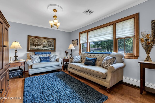 711 Hardean Rd, Brick, NJ 08724 - living room featuring wood finished floors, crown molding, a chandelier, and baseboards