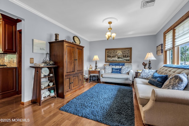 711 Hardean Rd, Brick, NJ 08724 - living room with a chandelier, light wood finished floors, ornamental molding, and baseboards