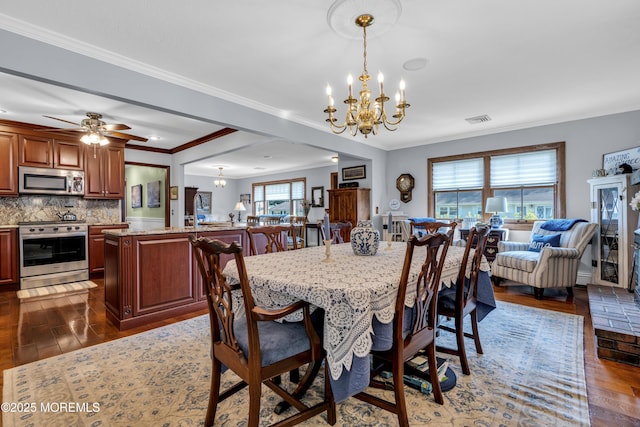 711 Hardean Rd, Brick, NJ 08724 - dining room with a chandelier, wood-type flooring, crown molding, and a ceiling fan