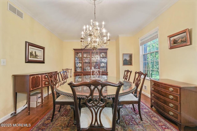 2 Warrenton Ln, Colts Neck, NJ 07722 - dining space featuring dark wood-style floors, baseboards, a chandelier, and ornamental molding