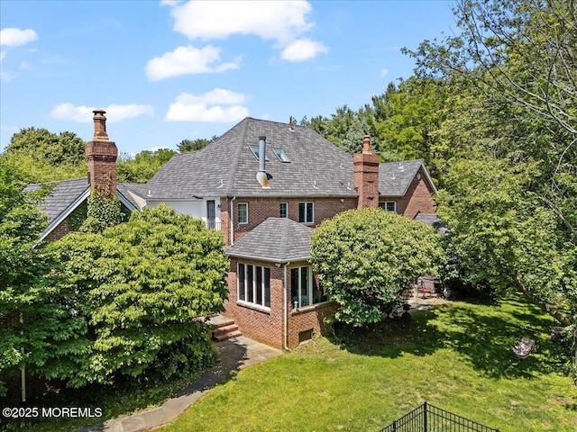 2 Warrenton Ln, Colts Neck, NJ 07722 - back of property with brick siding, a chimney, and a yard