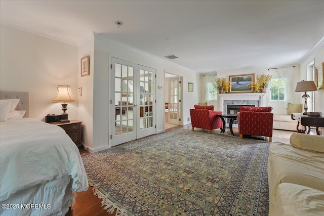 2 Warrenton Ln, Colts Neck, NJ 07722 - bedroom with french doors, crown molding, wood finished floors, a premium fireplace, and baseboards