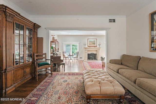 2 Warrenton Ln, Colts Neck, NJ 07722 - living room featuring wood finished floors, ornamental molding, and a fireplace with raised hearth