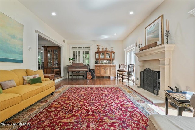 2 Warrenton Ln, Colts Neck, NJ 07722 - living area featuring a fireplace with raised hearth, wood finished floors, and recessed lighting