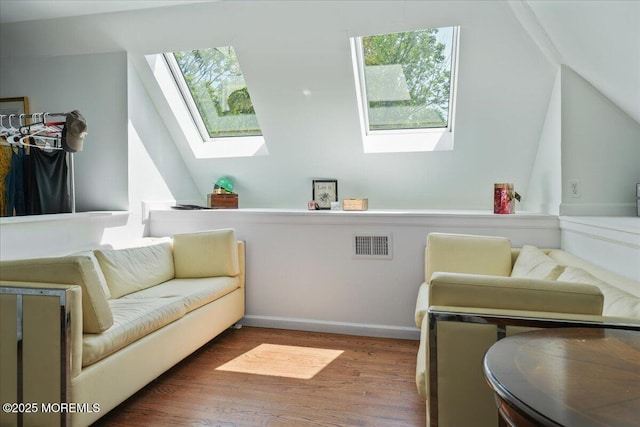 2 Warrenton Ln, Colts Neck, NJ 07722 - living area with a skylight, wood finished floors, and lofted ceiling