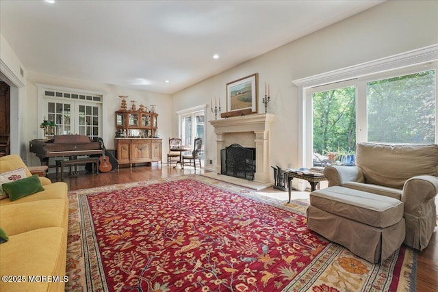 2 Warrenton Ln, Colts Neck, NJ 07722 - living area featuring plenty of natural light, a fireplace with raised hearth, wood finished floors, and recessed lighting