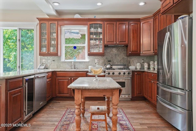 2 Warrenton Ln, Colts Neck, NJ 07722 - kitchen with stainless steel appliances, beverage cooler, glass insert cabinets, decorative backsplash, and recessed lighting