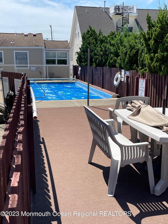1301 SW Central Ave Unit B8, Seaside Park, NJ 08752 - view of swimming pool with a patio area