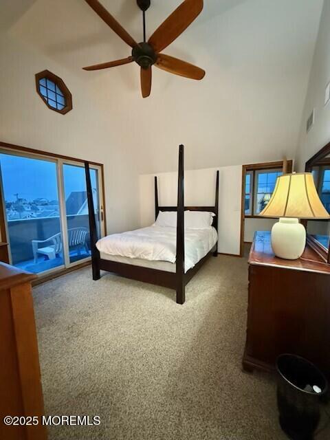 1301 SW Central Ave Unit B8, Seaside Park, NJ 08752 - bedroom featuring carpet, high vaulted ceiling, access to outside, and a ceiling fan